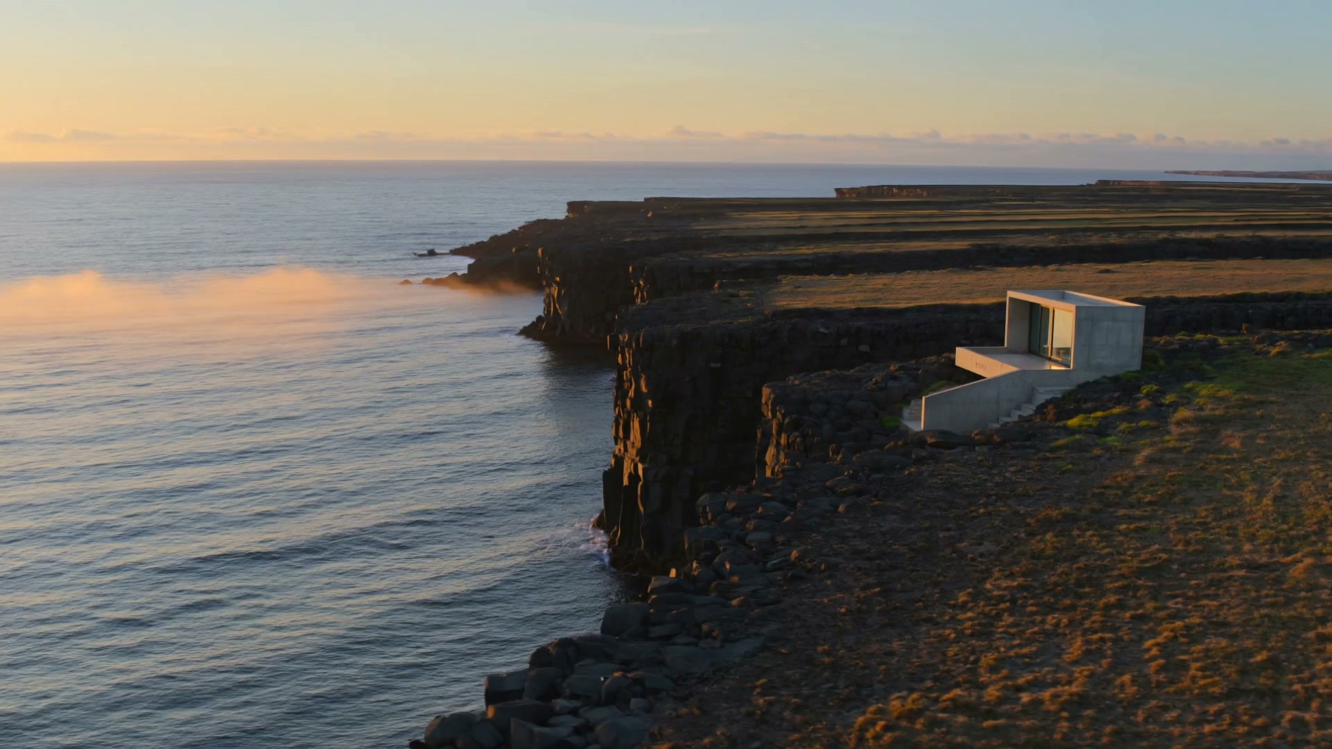An architectural retreat above a cinematic coastline